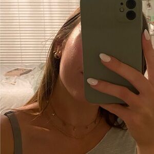 Gold butterfly necklace stack